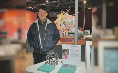 Postdoc Michal Bartkowski visiting the exhibition.