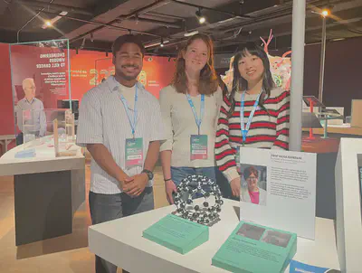 PhD students Yingru Zhou (First from right), Aravind Kannoth Anilkumar (First from left) and summer intern Claudia Carminati (middle) volunteering at the exhibition.